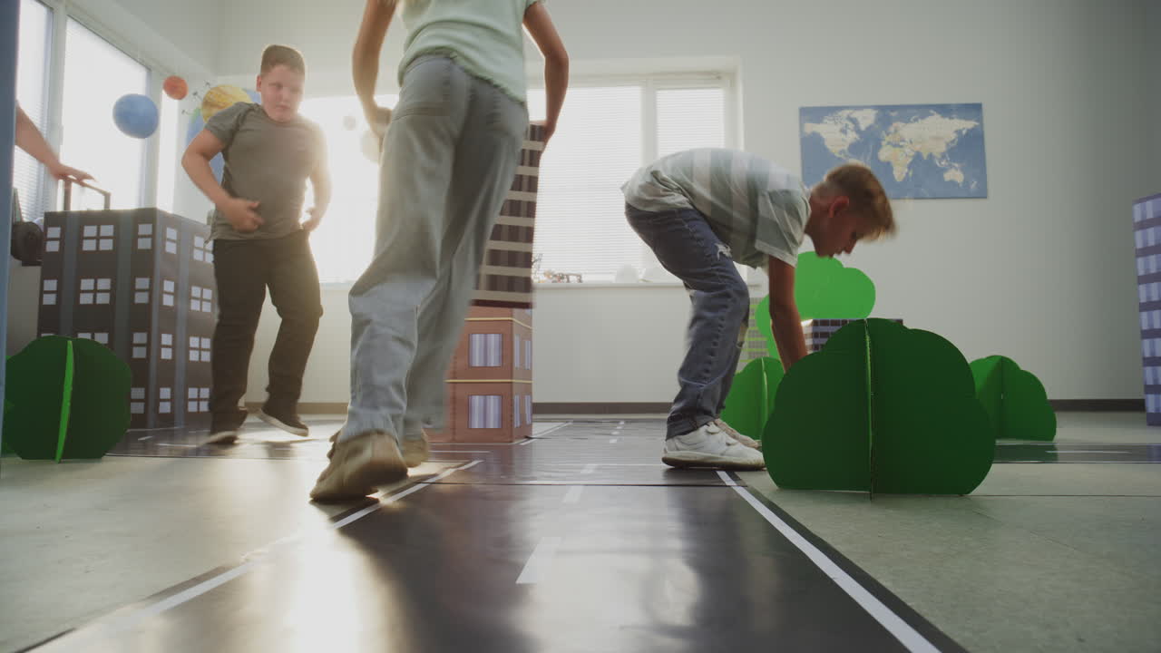 Smart Young Kids in Hardhats Creating Interactive Urban Planning