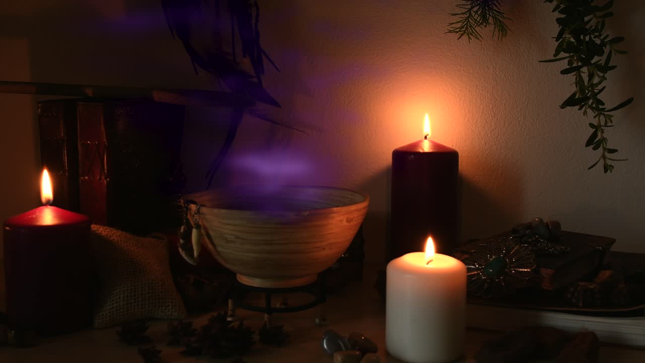 Detail of a potion making witch room, with purple steam coming out from a wooden bowl, animal teeth hanging from it, candles with flickering flames, old books, glasses and herbs in the background