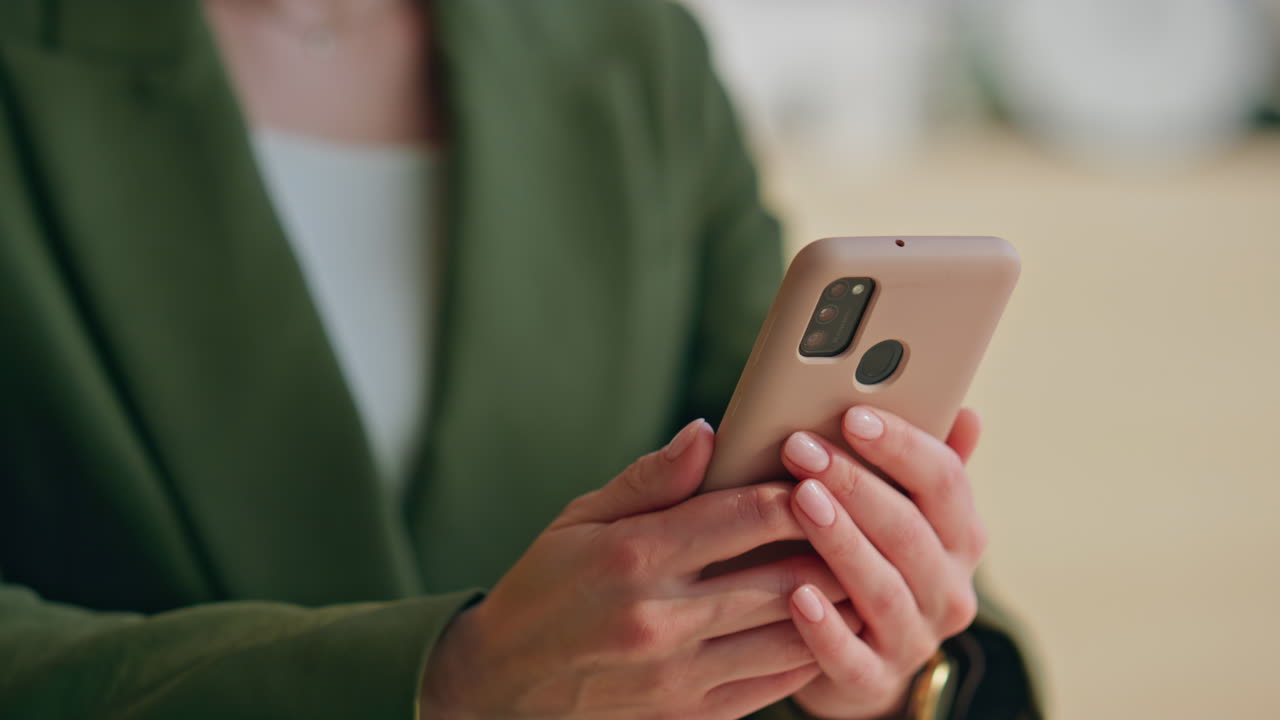 Closeup businesswoman fingers working phone at workplace. Woman using cellphone