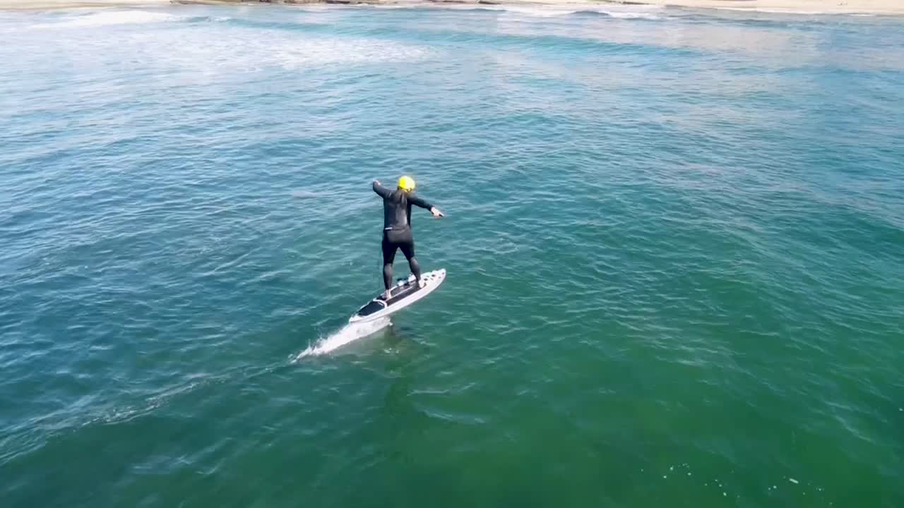 Man Riding an eFoil on the Ocean