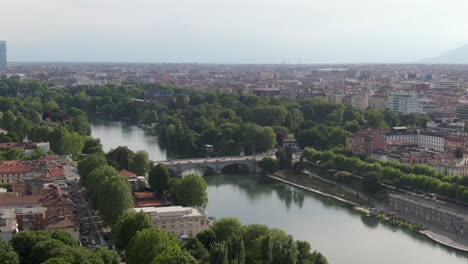 Beautiful-bridge-over-river-Po-and-cityscape-of-Turin,-aerial-drone-view