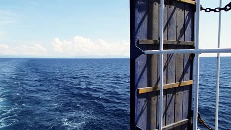 View-from-the-stern-of-a-passenger-ship-sailing-the-seas-off-Leyte,-Philippines