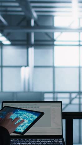 vertical video server room coworkers using artificial intelligence on laptop and tablet