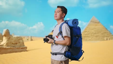 Traveler with Backpack and Camera in front of Egyptian Pyramids