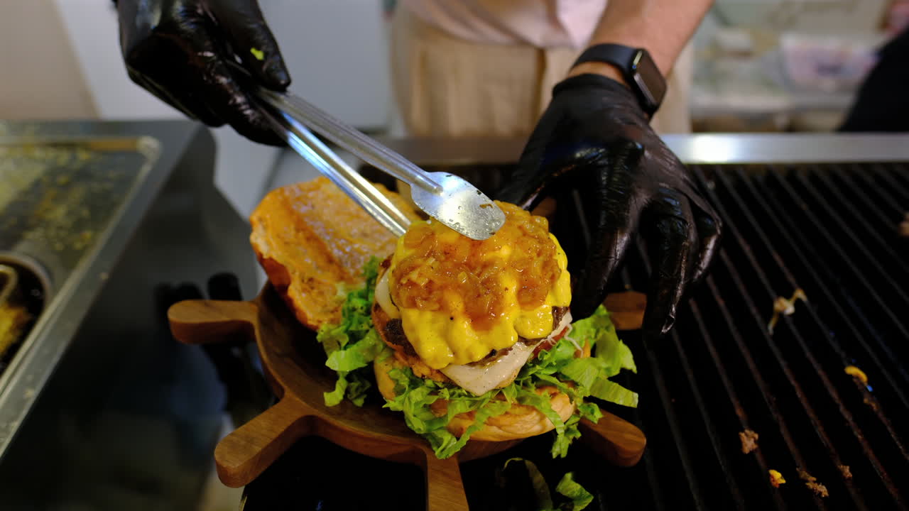 Stacking Perfection: Juicy Burger with Melted Cheese and Caramelized Onions