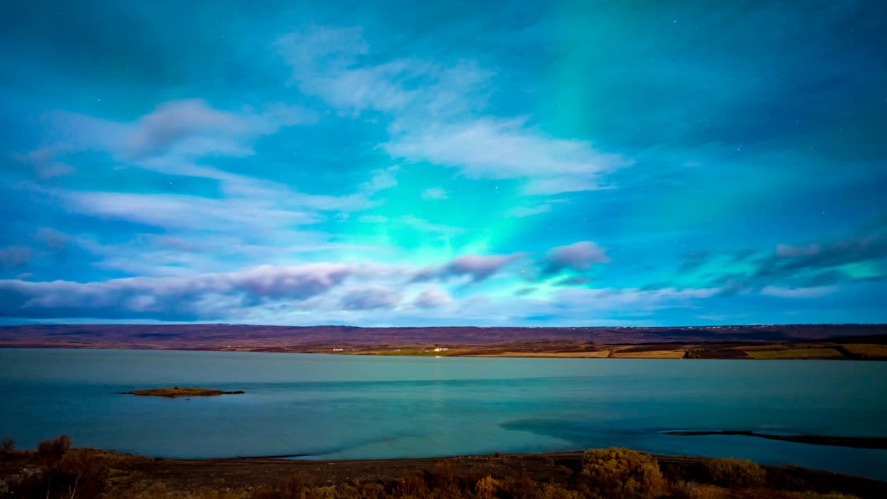 Aurora Borealis over a Calm Lake in Iceland
