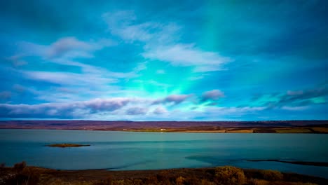 aurora borealis over a calm lake in iceland