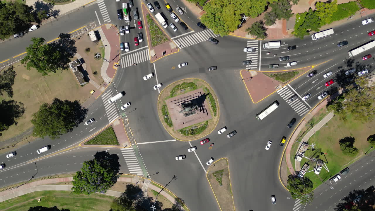 Aerial View of Busy City Traffic Roundabout with Moving Cars