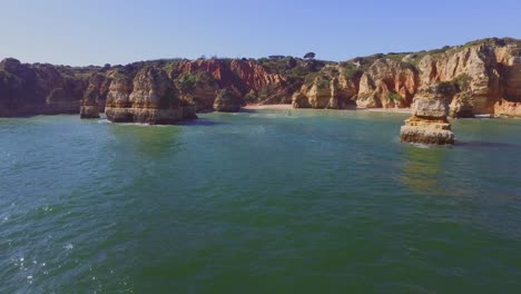 The-famous-cliffs-and-caves-of-Farol-da-Ponta-da-Piedade-in-Lagos,-Portugal