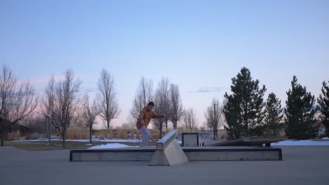 skateboarding at the skatepark in the snow