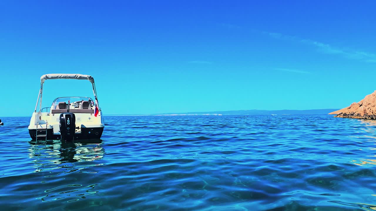 Scenic View of Camping Skrila Beach on Krk Island, Croatia Adriatic Coastline with Clear Blue Water, Rocky Shoreline and Peaceful Summer Atmosphere in Mediterranean Setting