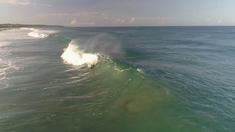 aerial shot of a boogie boarder on a tube barrel wave in zicatela beach, puerto escondido, oaxaca