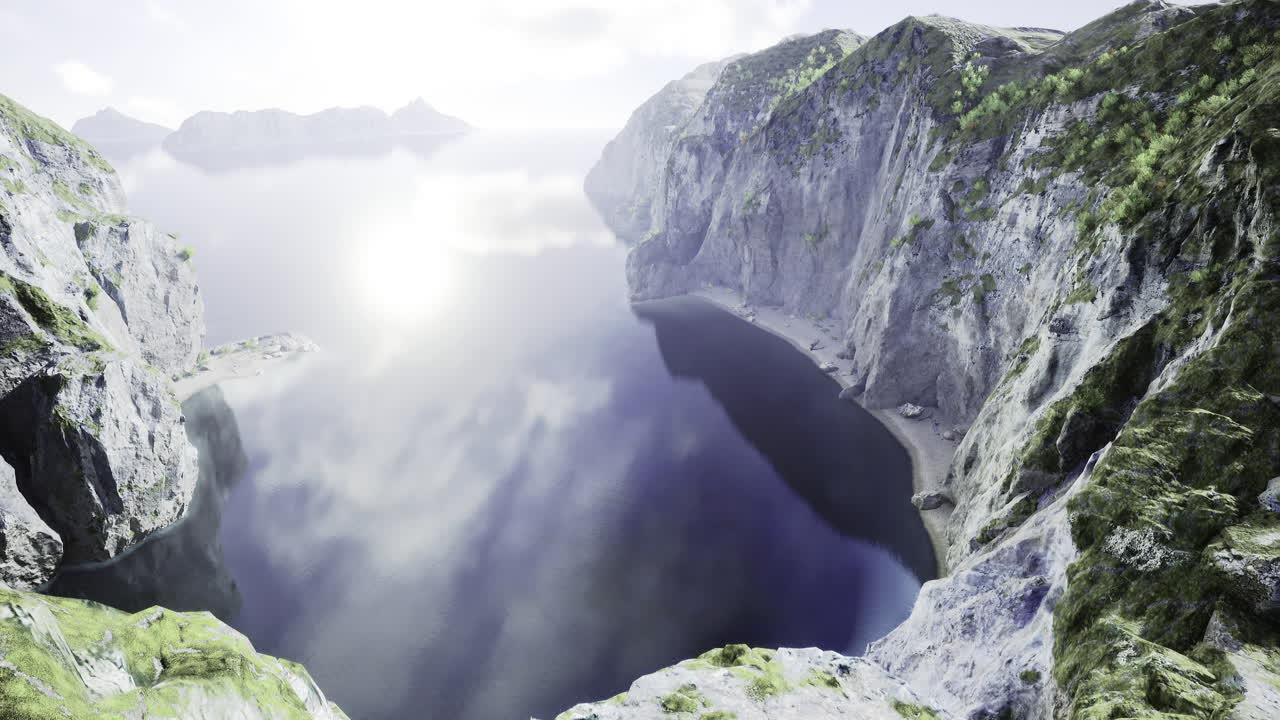 Majestic cliffs reflect sunlight over serene body of water at dawn