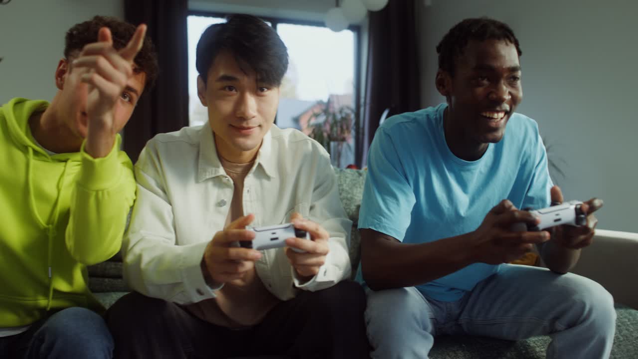 Friends playing video games with popcorn