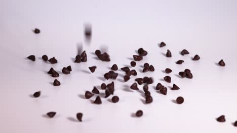 chocolate chips falling and accumulating on surface