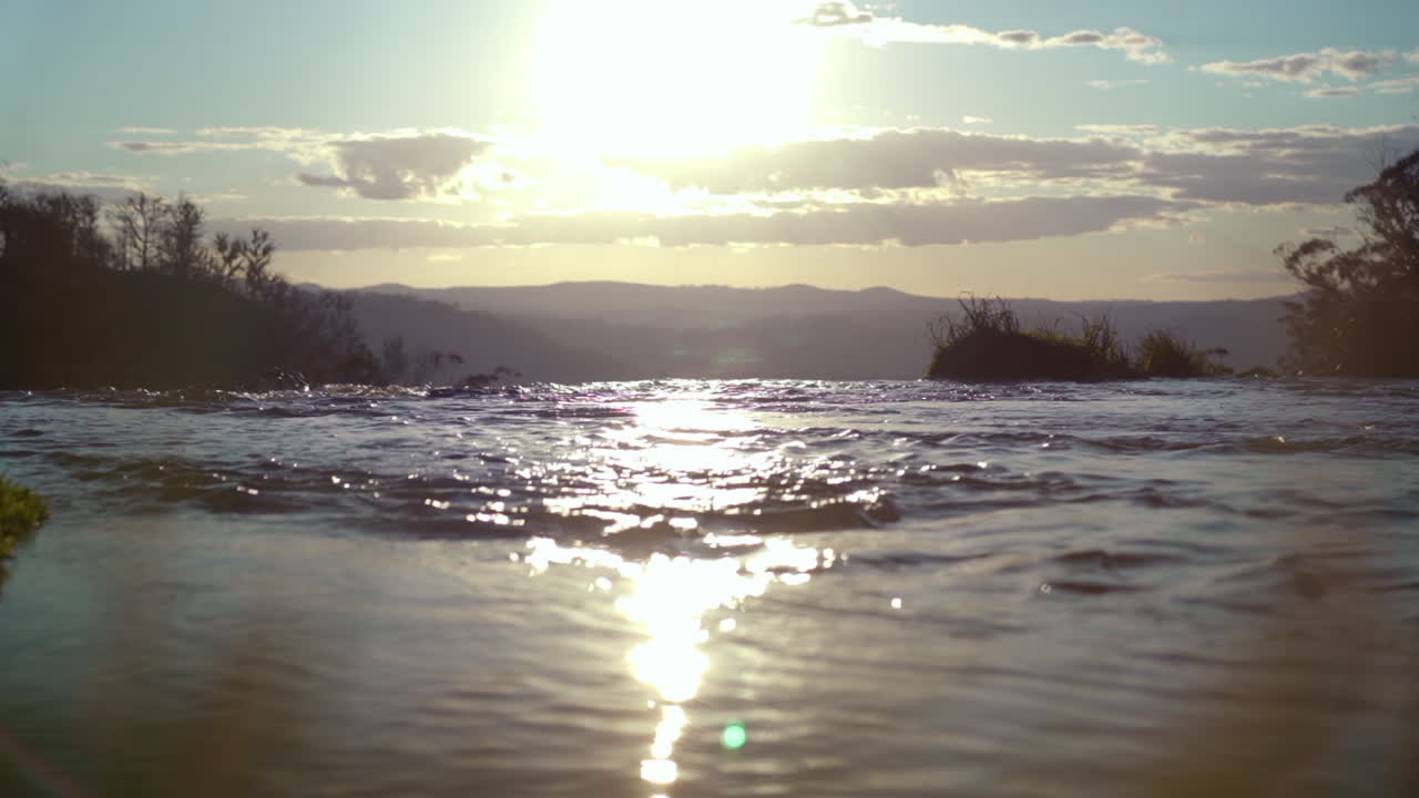 Sunset at the top of Ebor Falls waterfall in New South Wales