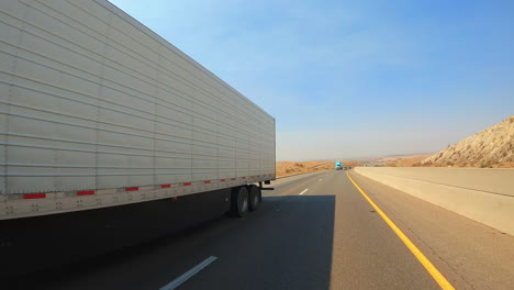 passing a long-haul freightliner truck on a steep-grade highway - slow motion