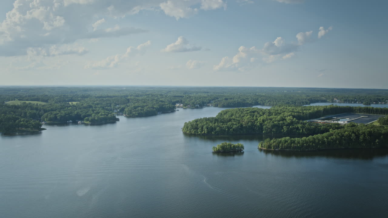 Aerial hyperlapse of boats sailing across the lake on the weekend on Hyco Lake in North Carolina
