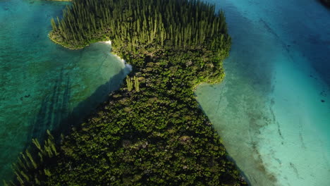 the small ile mwareya is part of the isle of pines in new caledonia - aerial flyover