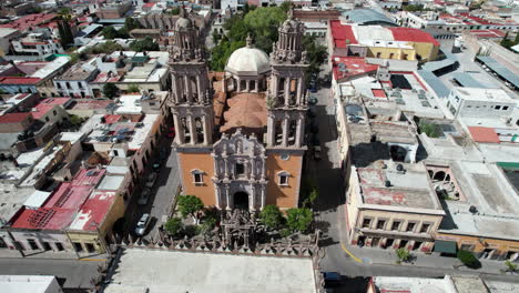 drone performs a half-orbit in front of the sanctuary in jerez, zacatecas, showcasing the architecture and bell towers