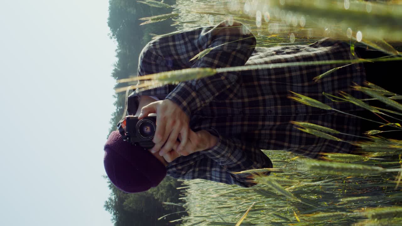 Photographer in a wheat field