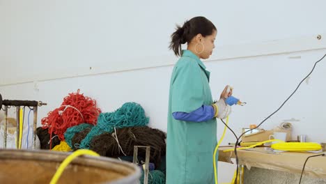 worker using rope cutting gun in rope making industry 4k