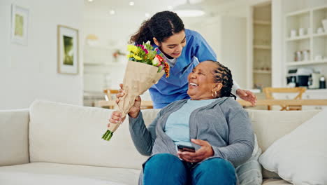 Sofa,-flowers-and-elderly-woman-with-caregiver