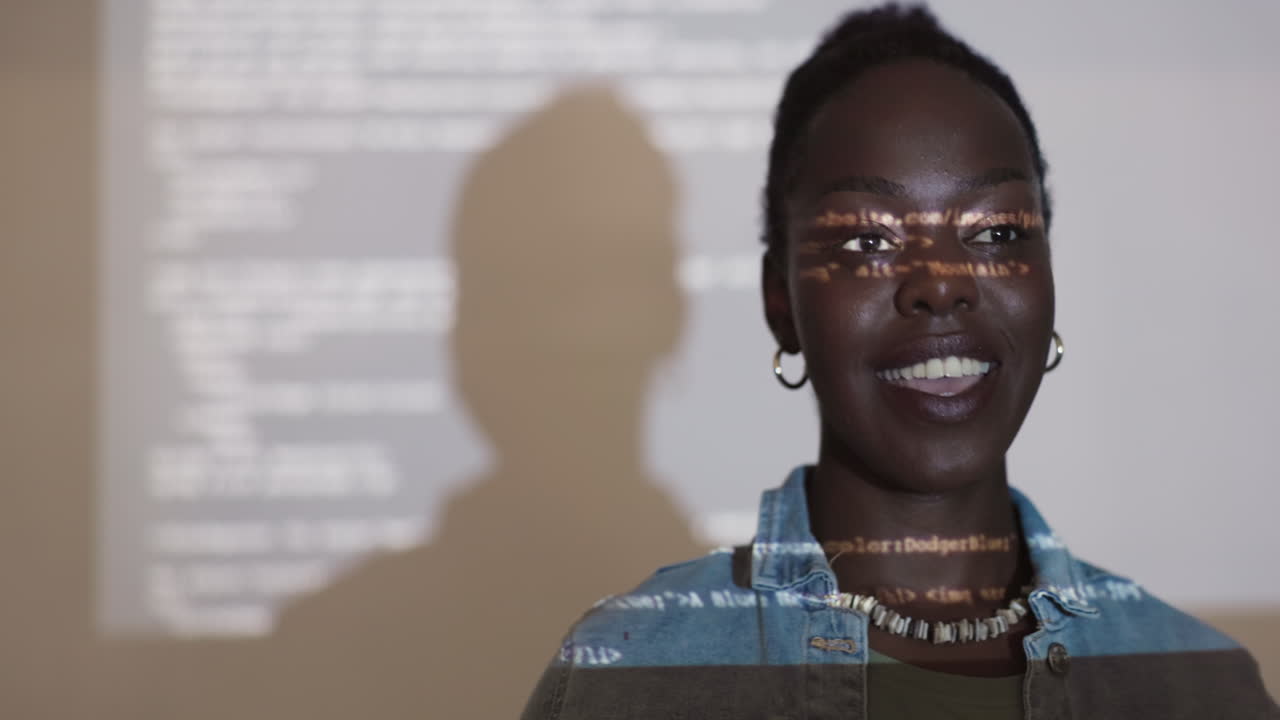 Woman presenting, projected code on face