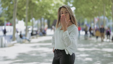 Girl-posing-on-street-and-smiling-at-camera