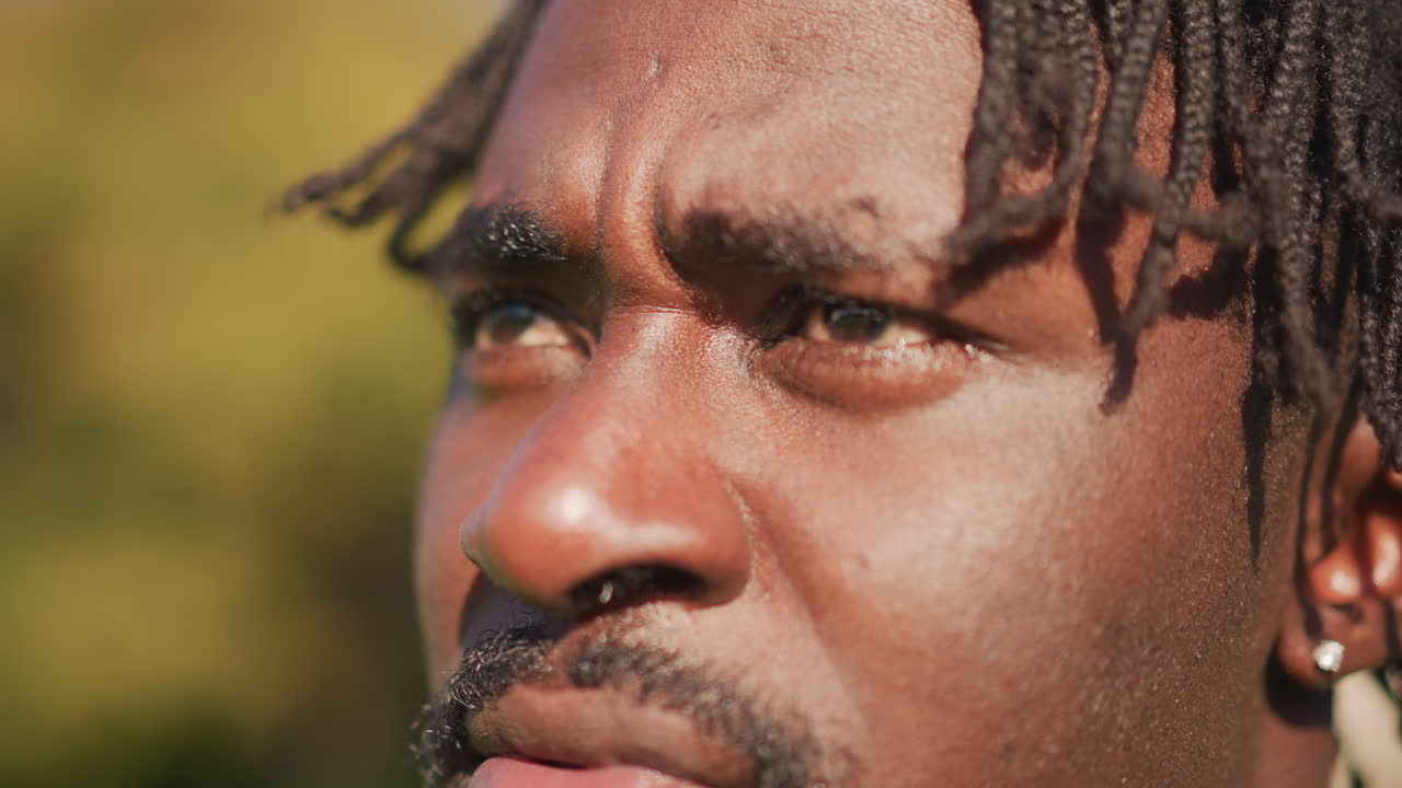 Intense Trainer With Textured Locks, Dedicated Sports Coach With Warm Cinematic Expression, Passionate Trainer Appearing Resolute On Field With Distinct Dreadlocks And Warm Cinematic Lighting