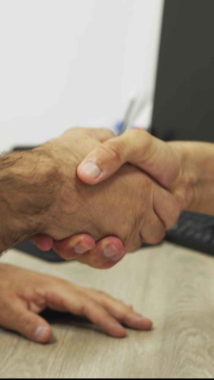 Handshake demonstrating agreement