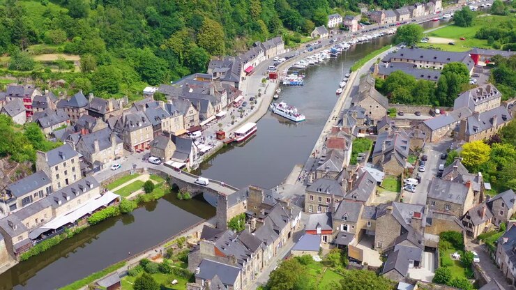 Aerial over the pretty town of Dinan France with highway bridge 1
