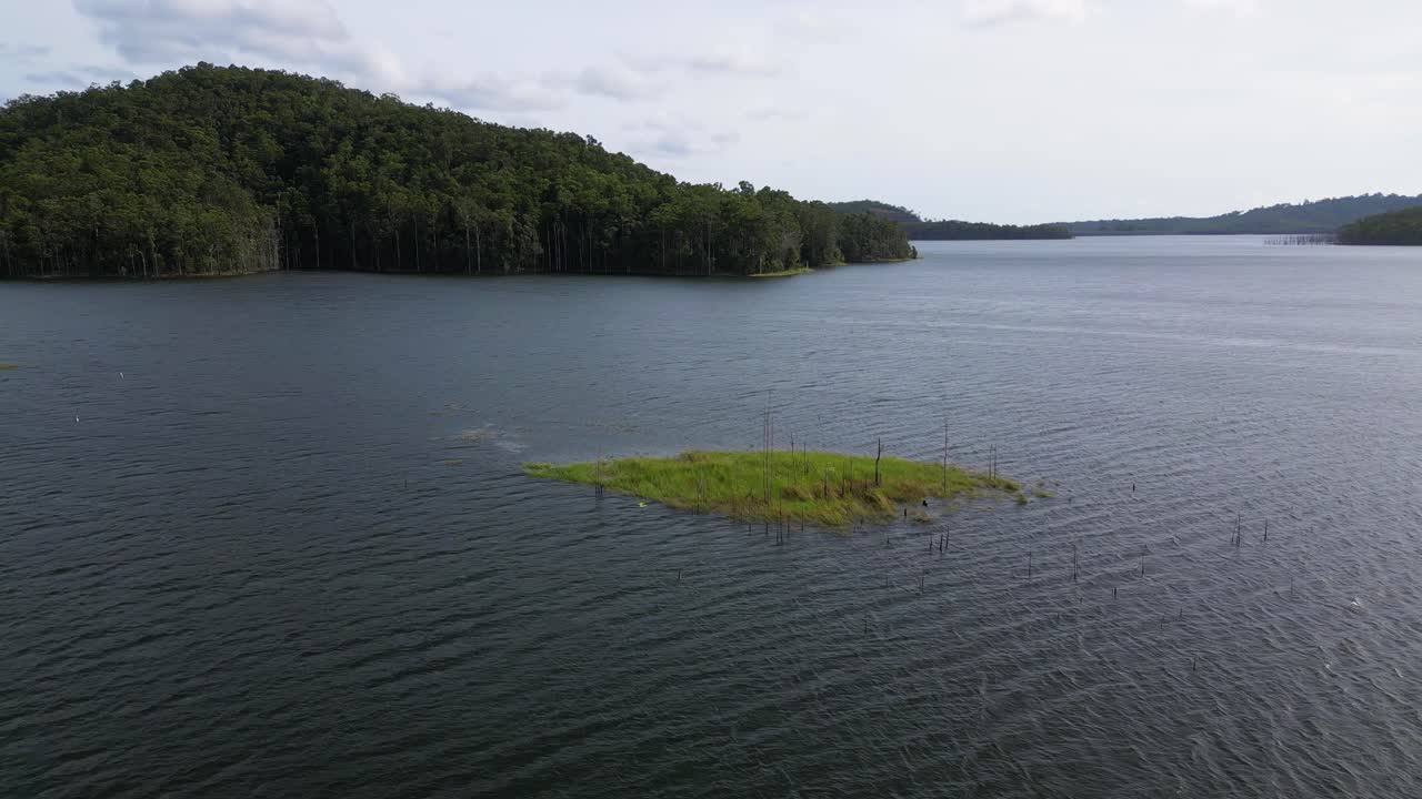 Circular aerial views of a small island on Advancetown Lake near the Western Boat Ramp on the Gold Coast Hinterland.
