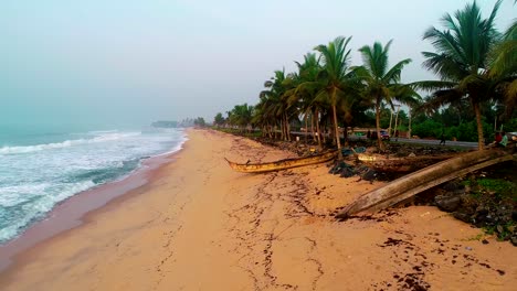 4K-footage-of-drone-flying-along-the-sea-shore-or-beach-with-golden-sunrise