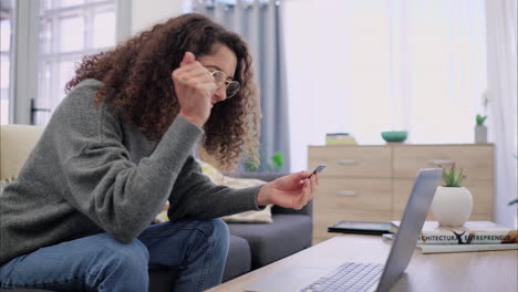 Woman-online-shopping-in-living-room