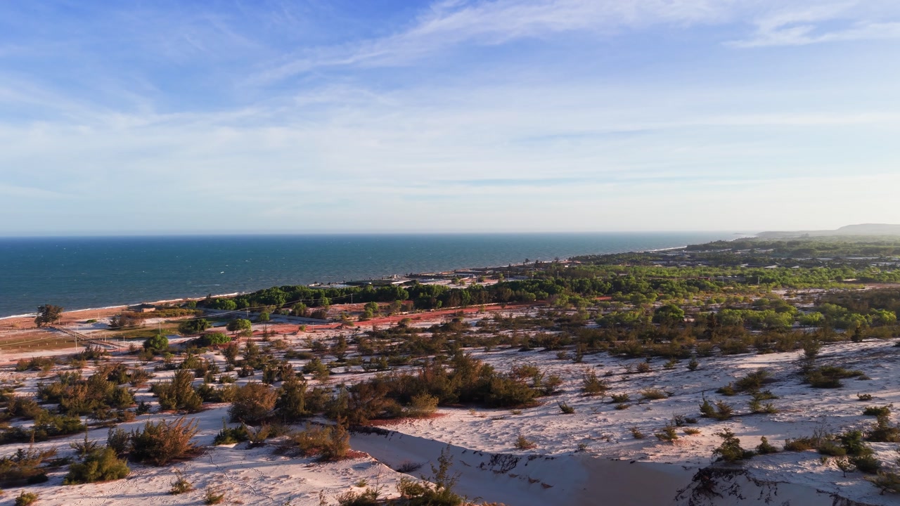 Explore the less touristy white sand dunes in binh thuan vietnam with a view of nature and the coast.