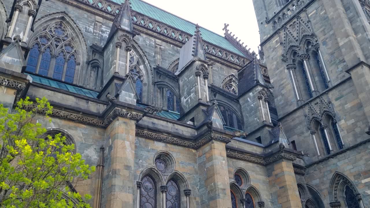 Close-up of intricate details of Nidaros Cathedral in Trondheim, showcasing its Gothic architecture and masterful stone carvings
