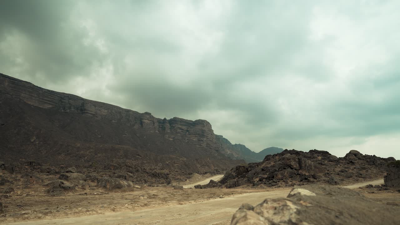 Time lapse cloudscape above the rugged mountains in Oman near the Yemen border on an overcast and moody day