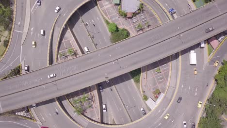 Slow-rotating-aerial-shot-of-traffic-and-roads-in-roundabout-Aguacatala-in-Medellin