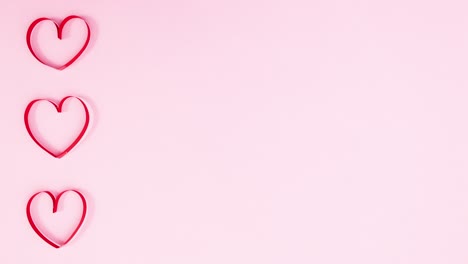 valentine's day hearts beating on left side of pastel pink theme. stop motion