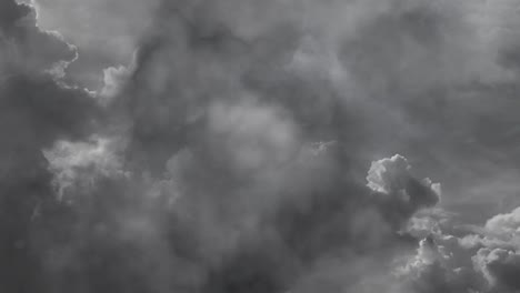 thick cumulonimbus clouds and lightning flashing