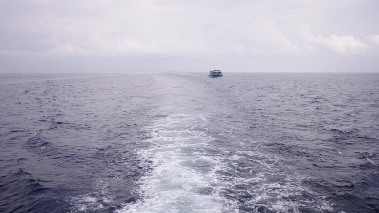 Boat Wake on the Open Ocean with Distant Vessel