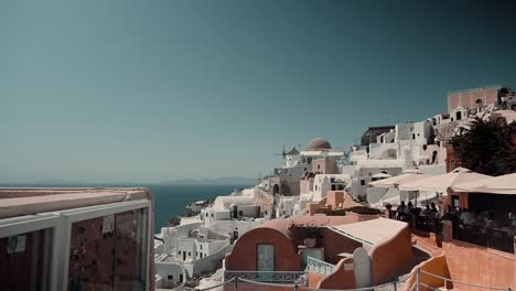 clip of a greek island from the top of a traditional beautiful housing complex