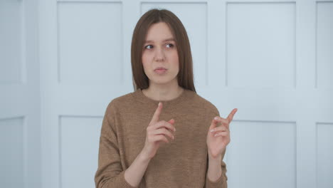 Confident-businesswoman-webinar-speaker-coach-teacher-talking-looking-at-camera.-woman-in-office-talking-waving-hand-sending-air-kiss-looking-at-camera-using-modern-laptop.-Communication-concept.