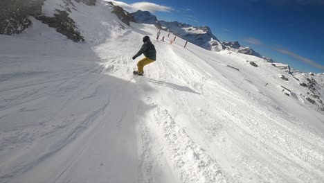 snowboarder making wide turns in slow motion