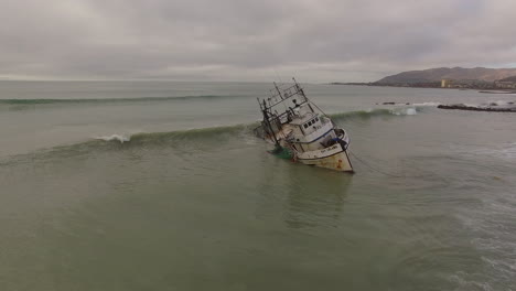 aerial shot over a shipwrecked fishing boat near ventura california 1