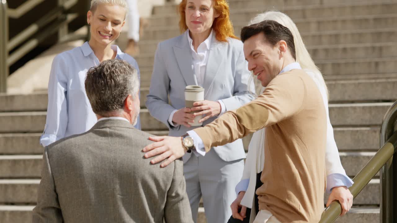 Business professionals shaking hands on outdoor steps