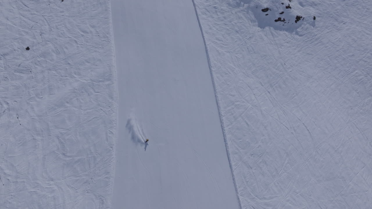 High performance alpine ski carving on groomed pistes in Verbier Bruson and Val de Bagnes filmed with drone and follow cam on a bluebird winter day showcasing fast dynamic fun skiing