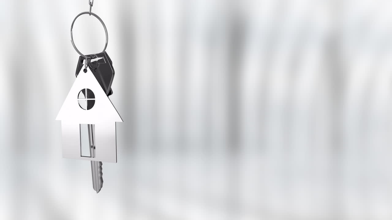 animando el llavero en forma de casa sobre un fondo borroso