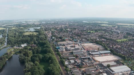 slider drone shot over building development cheshunt and natural reserve lea river